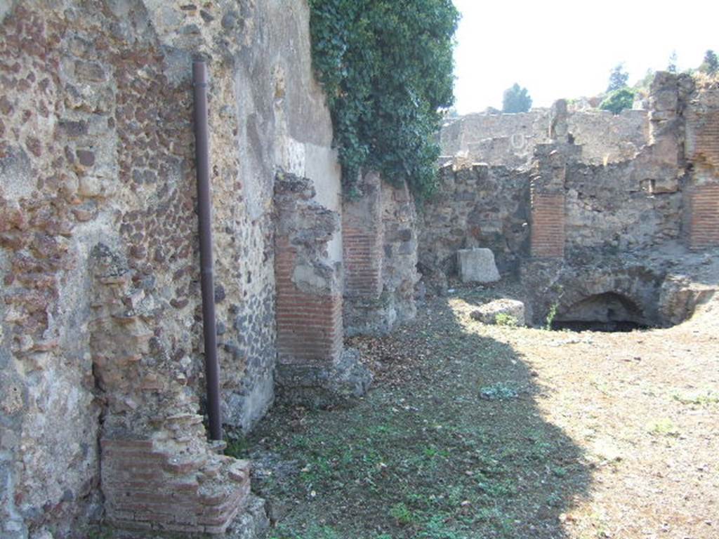 VI.9.2 Pompeii. September 2005. Room 44. South wall. A corridor (30) ran from the south west corner of room 44 joining it to VI.9.2. This is now blocked and room 44 is now only accessible from VI.9.13.