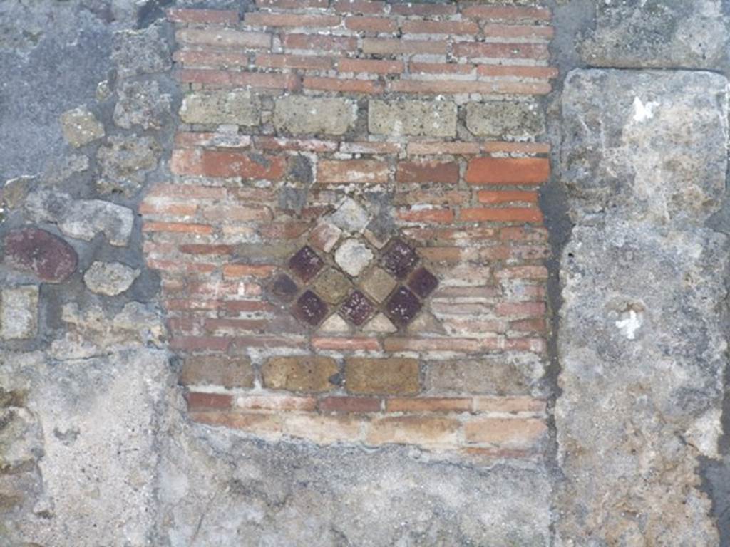 VI.9.2 Pompeii. March 2009. Room 2, atrium and impluvium. Detail of atrium wall between rooms 13 and 14.