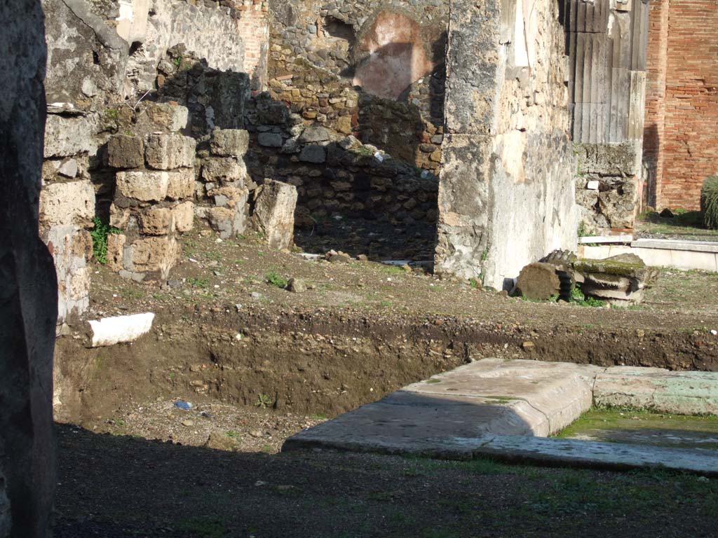 VI.9.3 Pompeii. December 2005. 
North side of atrium, with excavation on north side of impluvium, and doorway to room 7 in the north-east corner.
See Rivista di Studi Pompeiani, XVI, 2005, (p.188-9)
