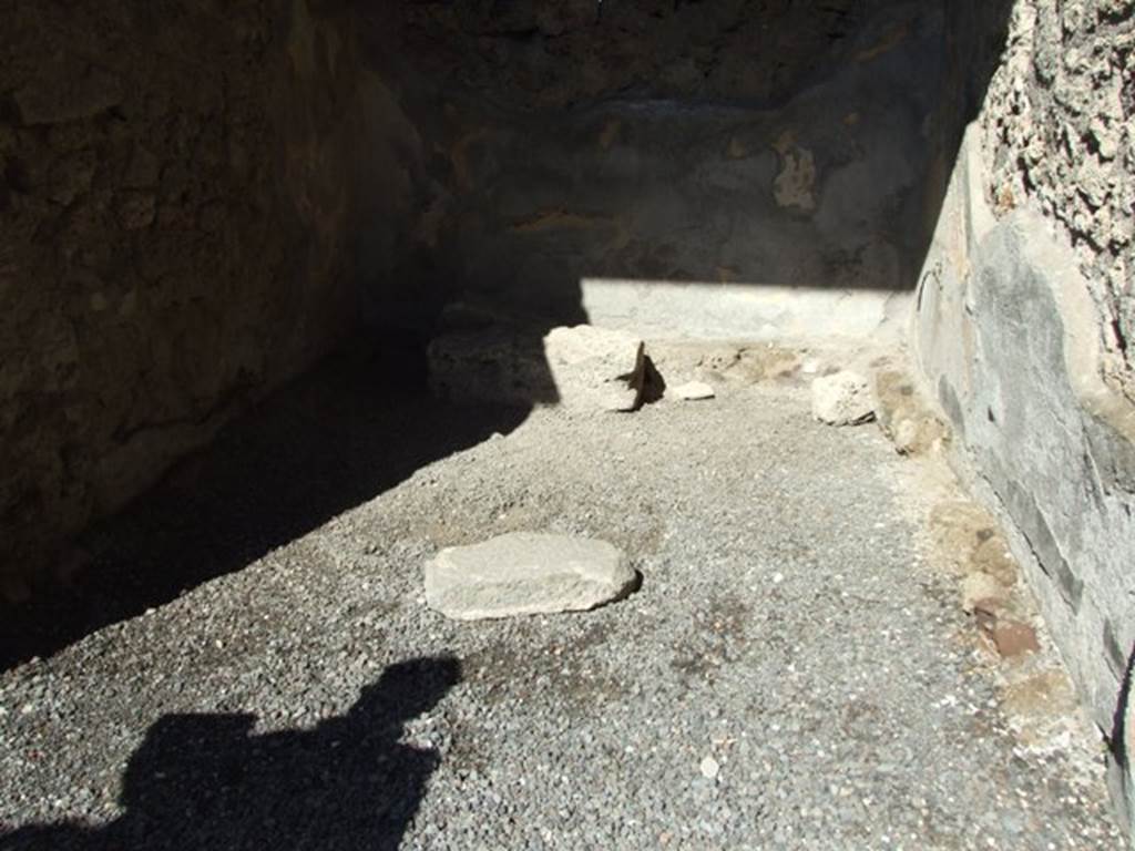 VI.9.6 Pompeii. March 2009. Room 11, remains of supports for benches around the west, north and east walls.