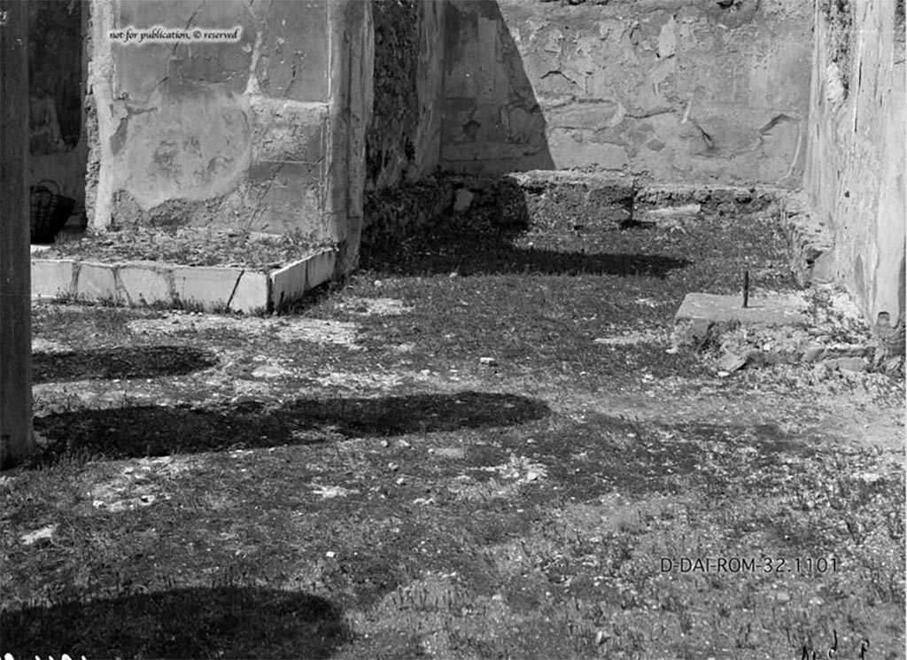 VI.9.6/7 Pompeii. 1932. Looking north across atrium towards two chest bases on either side of left ala.
According to Pernice –
Found on the left ala next to the passage to the peristyle in the atrium. 
Almost square lava block, walled with rubble stones (including bricks). The stone lies crookedly in the wall. 
In the middle there is a long spike in the lead casting. 
The base was moved at some point, which could be where the pieces of brick come from.
See Pernice, E., 1932. Hellenistische Tische, Zisternenmündungen, Beckenuntersätze, Altäre u. Truhen. Berlin, p. 75, Taf. 45.3.
DAIR 32.1101. Photo © Deutsches Archäologisches Institut, Abteilung Rom, Arkiv. 
Thanks to Espen B. Andersson for assisting us in our interest in money-chests.
