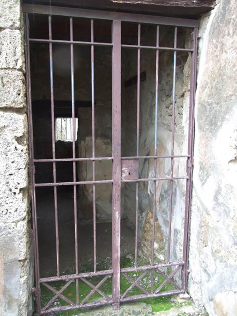 VI.10.1 Pompeii. March 2009. Doorway to two rooms on south side of east wall of bar-room.
According to Boyce, on the south wall beneath the stairs was a lararium painting: 
A single serpent about to devour the offerings  an egg and a pine cone  on a burning altar.
See Boyce G. K., 1937. Corpus of the Lararia of Pompeii. Rome: MAAR 14.  (p.50, no.180).
(Note: in Part 1 of VI.10.1, the lararium painting can be seen (courtesy of William Gell) against the west wall.)
According to Eschebach, near the stairs was the doorway into the two rooms on the south side.
See Eschebach, L., 1993. Gebudeverzeichnis und Stadtplan der antiken Stadt Pompeji. Kln: Bhlau. (p.192)

