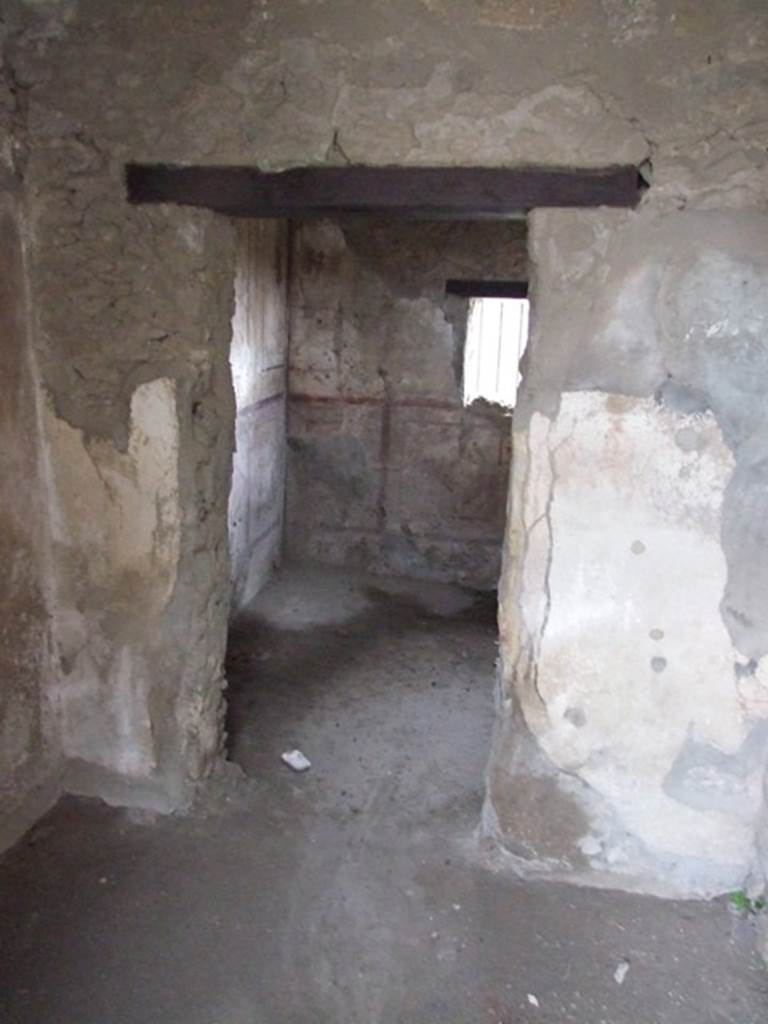 VI.10.1 Pompeii. March 2009. East wall of front room with doorway into rear room.