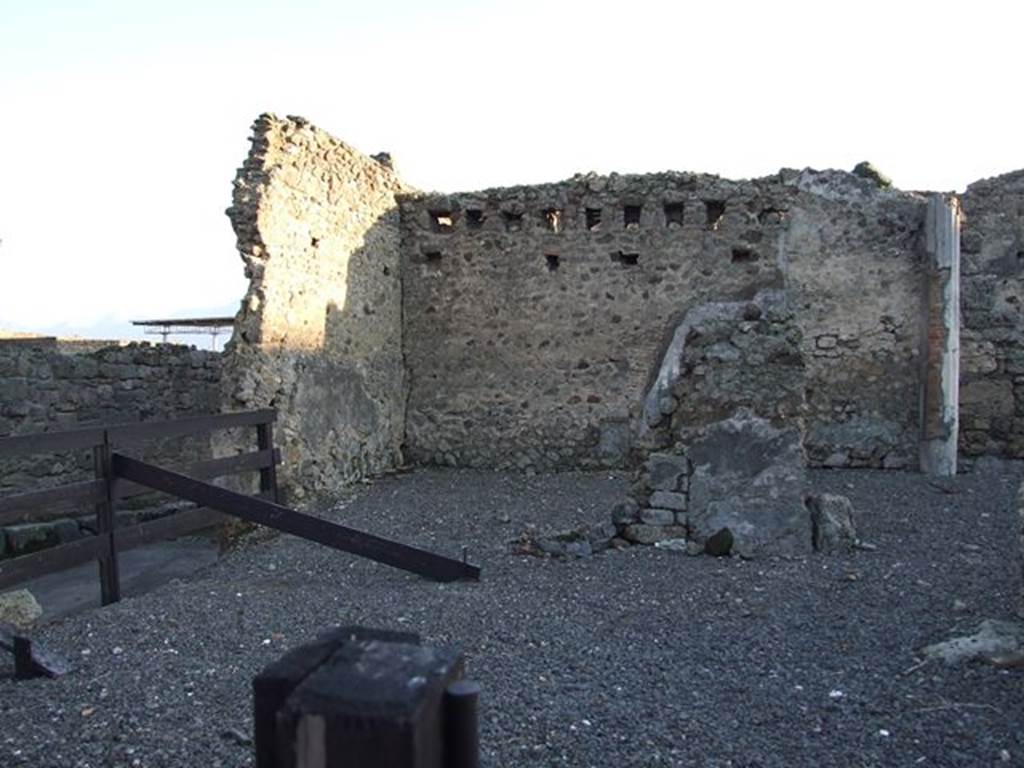 VI.10.2 Pompeii. December 2006. Looking towards site of triclinium in south-east corner. 
Looking south from Vicolo di Mercurio across area bombed in 1943. View showing total devastation of north-east sector of the house.
According to De Jorio 
Questa casa fu scavata parte nel 1826 e tutta poi nel 1831.
In questultima epoca si era disotterrato alle spalle del suo tablino un portico ed un piccolo viridario, donde per una scaletta si cala uscendo nellopposto vicolo,e nel tempo stesso si discende ad una stanza sotterranea.
(Trans: This house was excavated in part in 1826 and then completely excavated in 1831.
In this last era a portico and a small garden had been unearthed behind the tablinum, where a staircase descended into the opposite vicolo, and at the same time descended to an underground room.")
See De Jorio A., 1836. Guida di Pompei. Napoli: Fibreno, (p.105).
