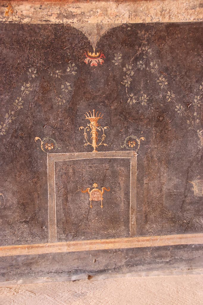 VI.15.1 Pompeii. October 2024. 
Lower west wall at north end, detail from painted zoccolo. Photo courtesy of Klaus Heese.
