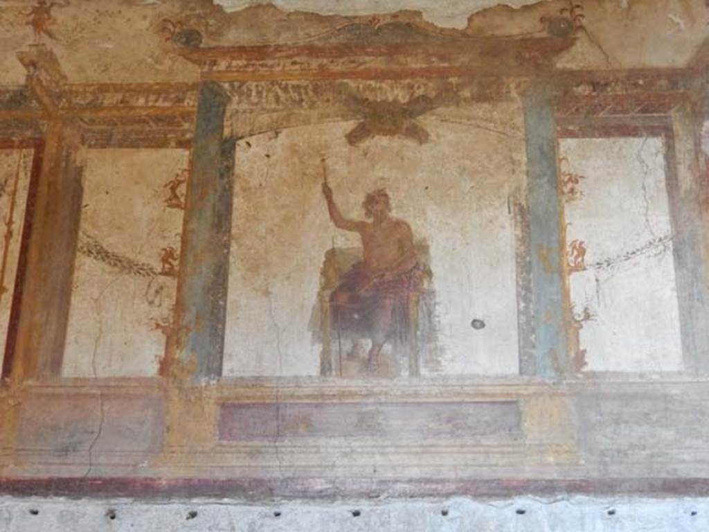 VI.15.1 Pompeii. May 2017. Painting of Zeus on his throne with sceptre and lightning bolt on upper centre of west wall. Photo courtesy of Buzz Ferebee.