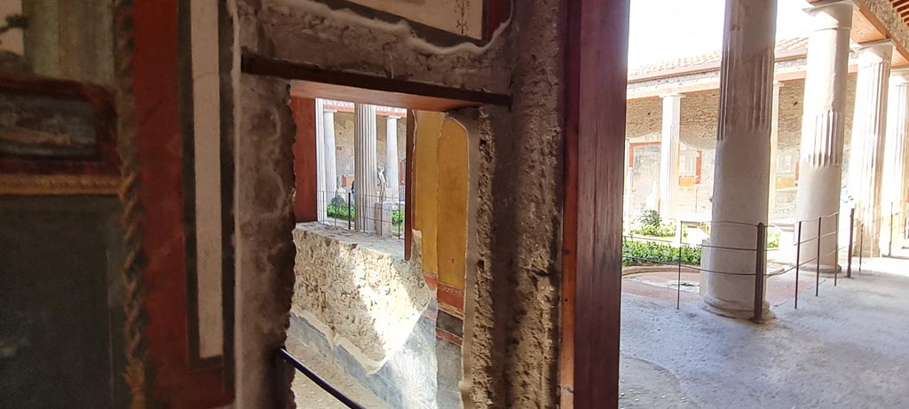 VI.15.1 Pompeii. April 2023. 
Looking towards west end of south wall, with doorway onto north portico, on right. Photo courtesy of Giuseppe Ciaramella.
