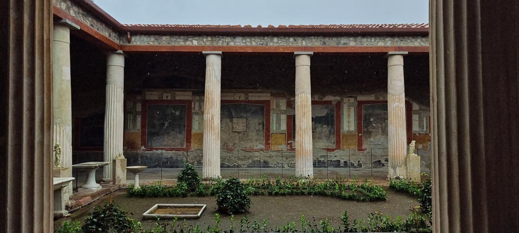 VI.15.1 Pompeii. December 2006. East side of peristyle, looking south.
The doorway on the left leads into the atrium, the next large doorway is to the Exedra in the SE of the peristyle, go to plan to view this room (PPM room - n).
The small doorway at the end of the east wall, is the doorway in the south-east corner of the peristyle. (PPM room – o).
