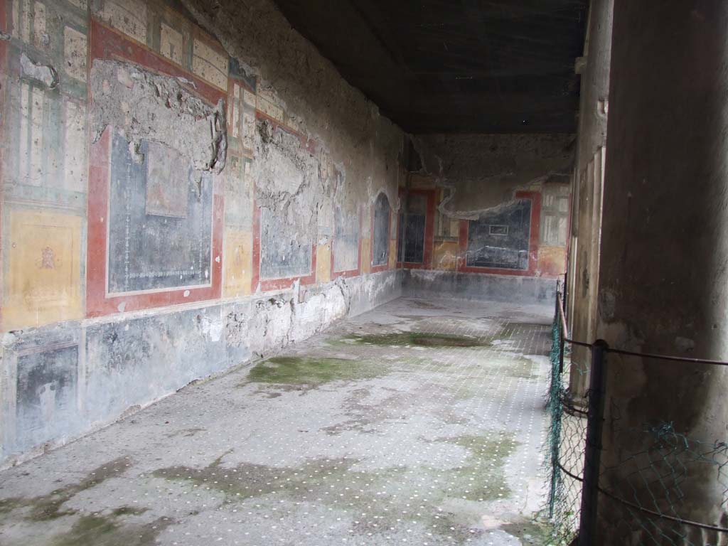 VI.15.1 Pompeii. April 1895. 
Watercolour by Luigi Bazzani, looking west towards south-west corner of peristyle.
Photo © Victoria and Albert Museum. Inventory number 7-1898. 
