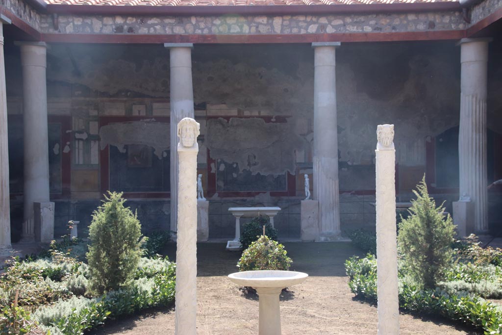 VI.15.1 Pompeii. October 2023. 
Peristyle, looking south towards herm on east side of peristyle garden. Photo courtesy of Klaus Heese.
