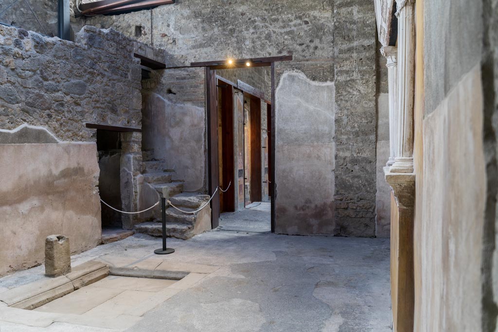 VI.15.1 Pompeii. March 2023. Looking south-east from service area towards doorway to atrium. Photo courtesy of Johannes Eber.