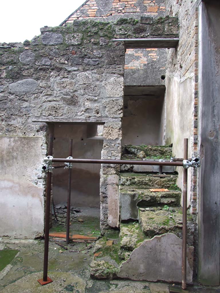 VI.15.1 Pompeii. October 2023. 
South-east corner with doorway to room below steps. Photo courtesy of Klaus Heese.
