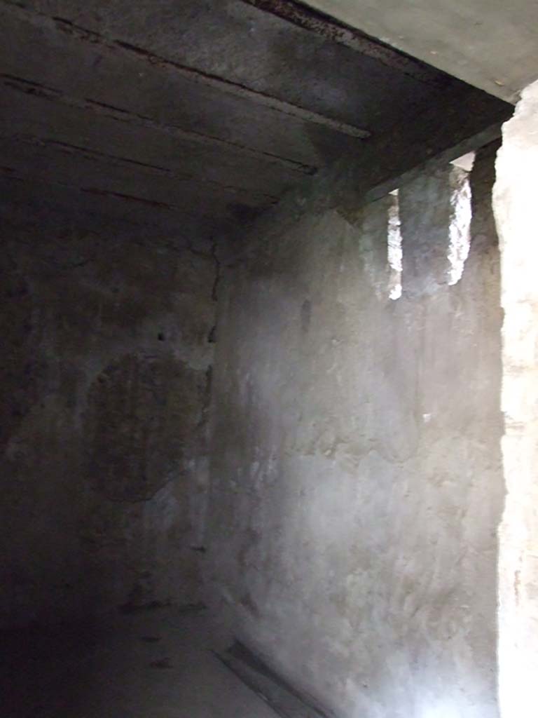 VI.15.1 Pompeii. April 2023. 
Looking south through doorway from services’ area into atrium. Photo courtesy of Giuseppe Ciaramella.
