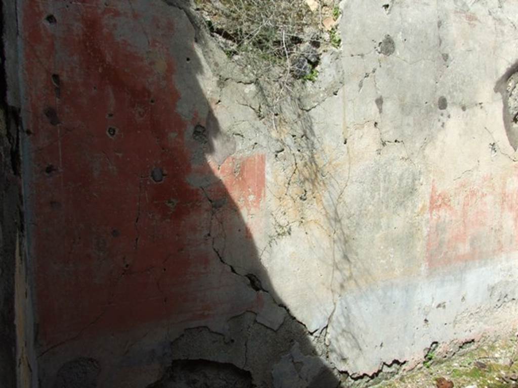 VI.16.28 Pompeii. March 2009. Room H, north wall. According to NdS, the decoration on this wall was the best preserved. The principle space was occupied by three major panels, yellow in the centre, with red on either side. There was no central painting exhibited in the middle. The frieze rather faded carried also panels of various colours, and the dado had a blackish background. In the height of the north wall was a bulls eye partly walled by the ancients. See Notizie degli Scavi di Antichit, 1908, (p.278-9)
