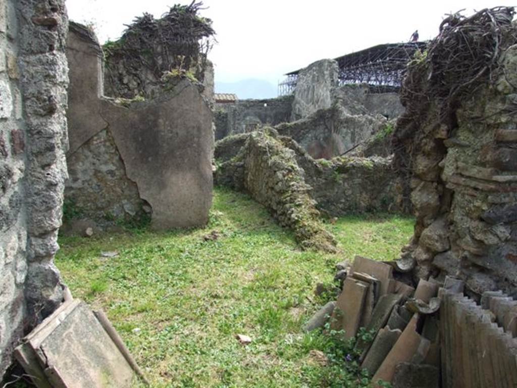 VI.16.29 Pompeii. March 2009. Room L, small garden area. According to Jashemski, the small garden at the rear of the house could be seen through a large window from entrance 30. The garden had a channel on the east, south, and west. This carried the rain water to an adjacent light well area, (room K) to the north. This was paved as a pool and had a cistern underneath. See Jashemski, W. F., 1993. The Gardens of Pompeii, Volume II: Appendices. New York: Caratzas. (p.164).