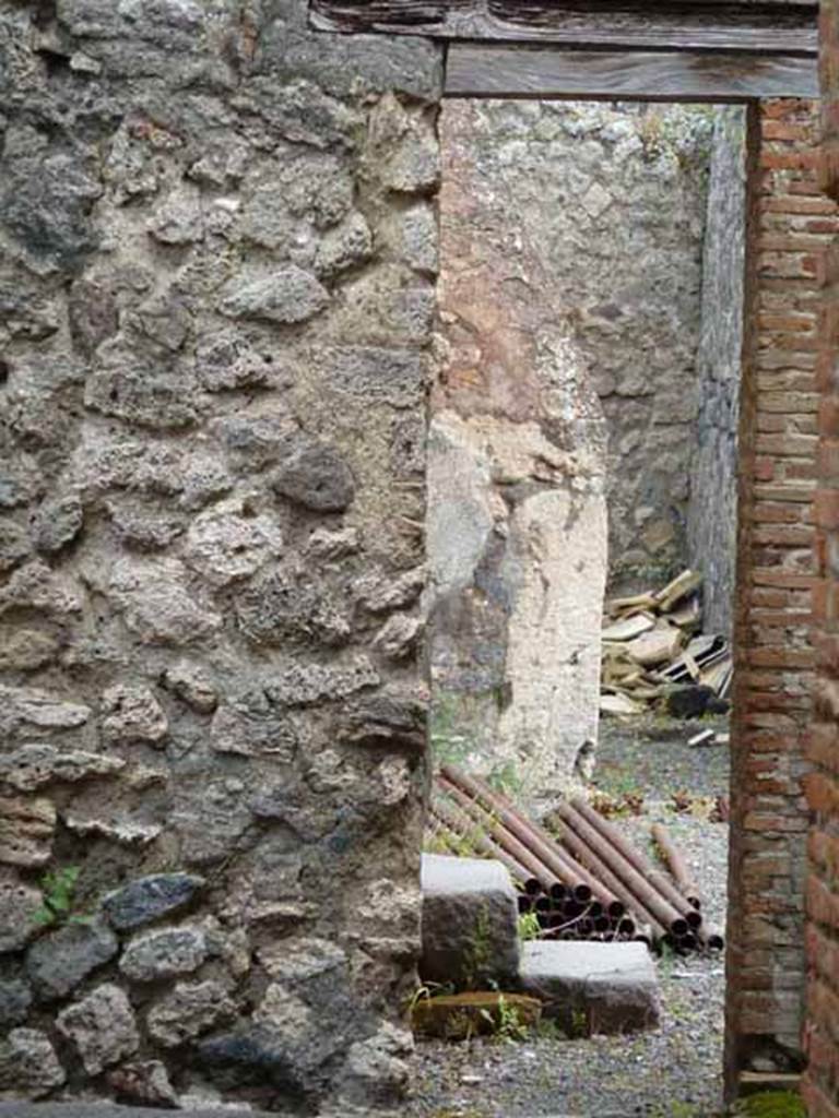 VII.1.46 Pompeii. May 2010. 
Looking east from room 17 towards steps in portico 18 and peristyle 19.

