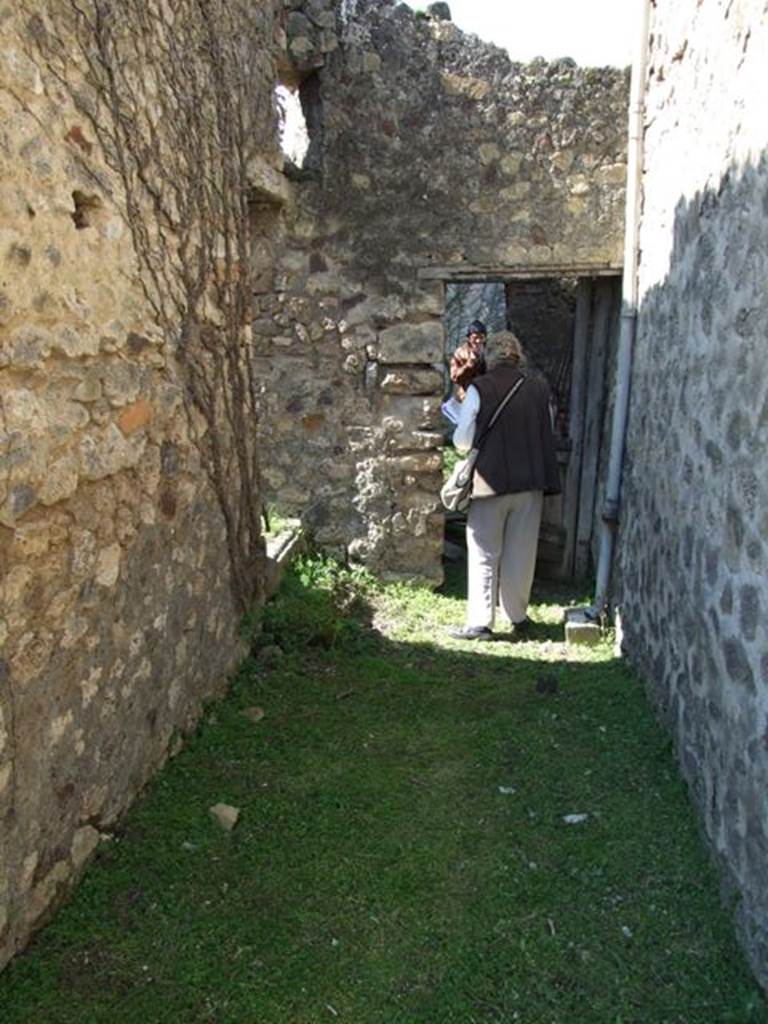 VII.2.16 Pompeii.  March 2009.  Room 12.  Corridor, looking west, with door to Room 14 on south side.