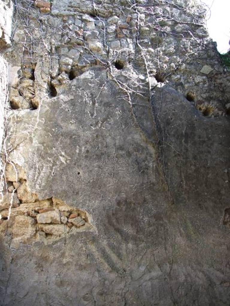 VII.2.18 Pompeii. March 2009. Room 14, east wall, with holes for remains of arched ceiling supports.