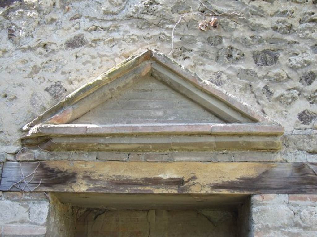 VII.2.18 Pompeii. March 2009. West side of peristyle, aedicula lararium brick pediment originally covered with stucco.