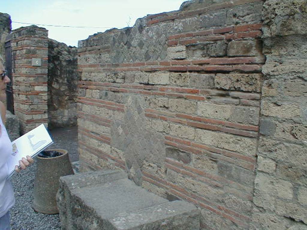 Outside VII.7.4 Pompeii. September 2004. Looking west towards entrance.