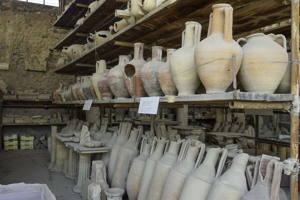 VII.7.29 Pompeii. August 2021. Looking west along north side towards items in storage. Photo courtesy of Robert Hanson.