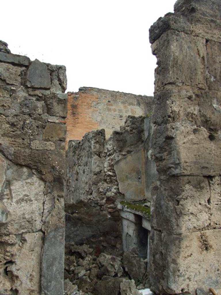 VII.9.47 Pompeii. March 2009. Room 10, small room with sacellum.
According to Boyce –
In a recess in the north wall of the atrium, to the right of the entrance, was a domestic shrine – described by Fiorelli as “un sacrario”.
See Fiorelli, Descr., 270.
See Boyce G. K., 1937. Corpus of the Lararia of Pompeii. Rome: MAAR 14. (p.69, no.304).
