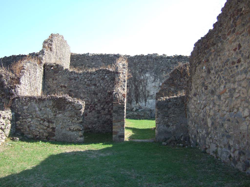 VII.12.7 Pompeii. September 2005. Looking south across shop-room towards rear room, and corridor to rear.