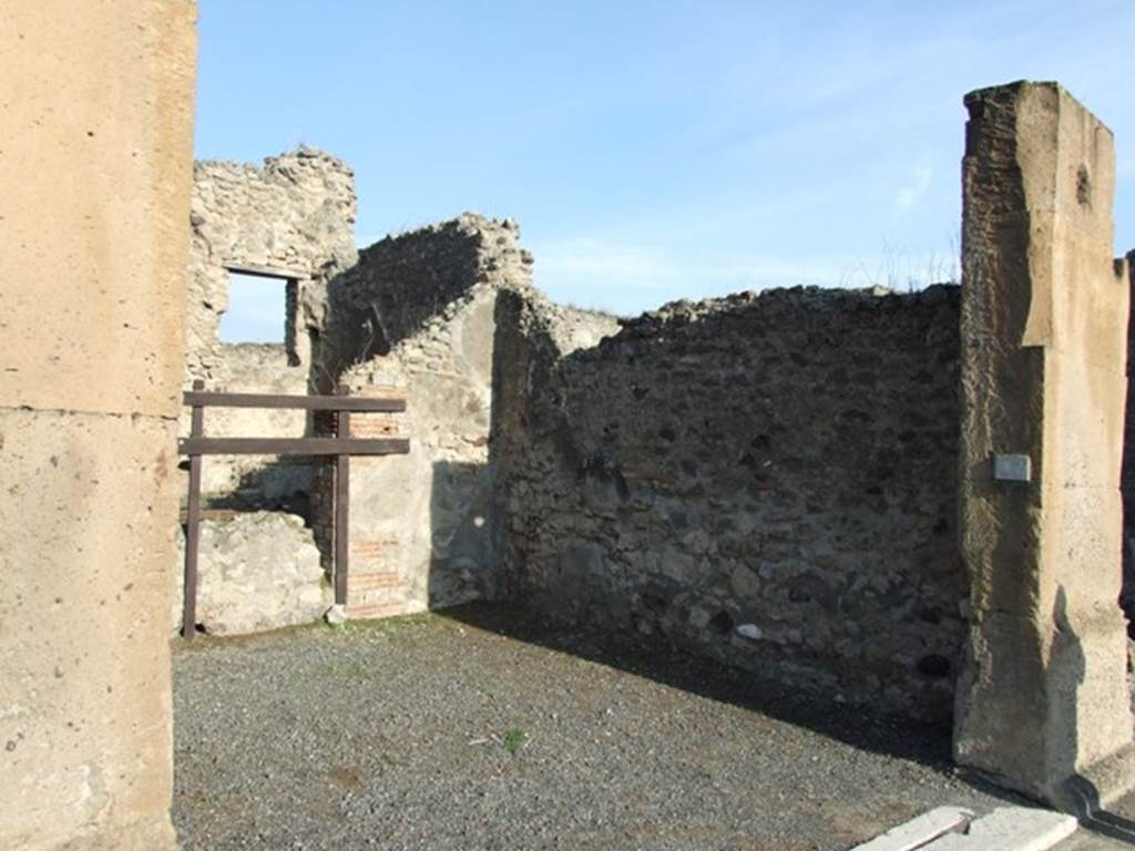 VII.13.1 Pompeii. December 2007. East wall of shop-room.