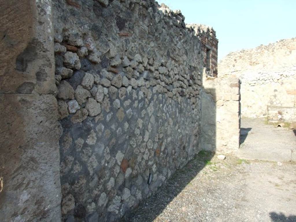 VII.13.7 Pompeii. December 2007. West wall of shop.