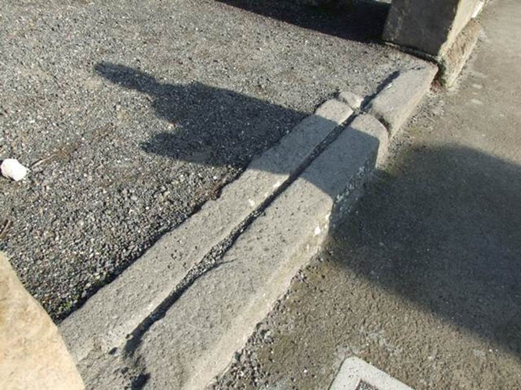 VII.13.9 Pompeii. December 2007. Entrance threshold or sill with groove for sliding doors.