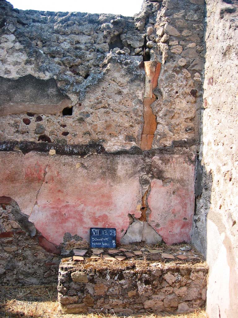 VII.13.23 Pompeii. July 2008. North wall with downpipe. Photo courtesy of Barry Hobson.