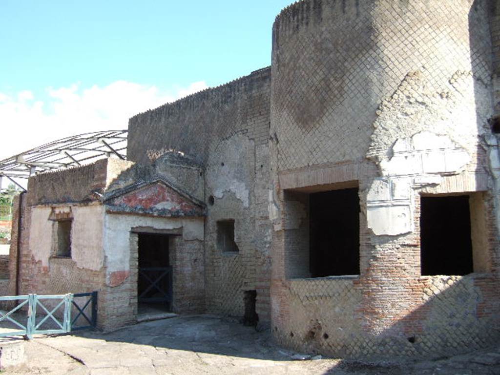 VII.16.a Pompeii. September 2005. Doorway to room 1 and windows of room 4, on east side of courtyard C.