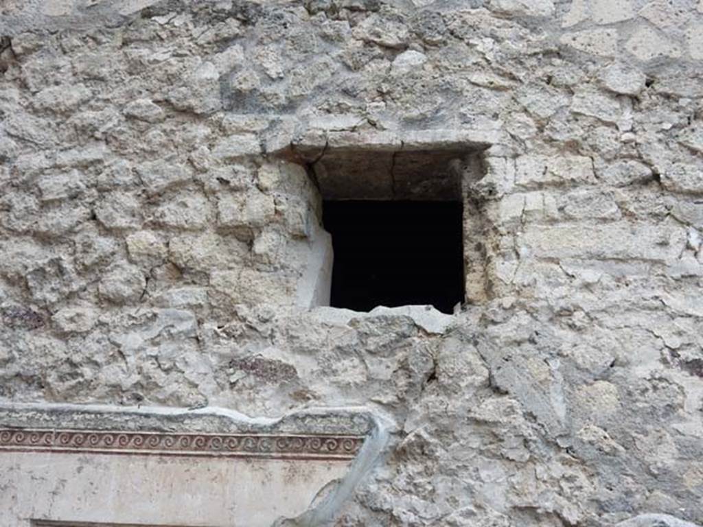 VII.16.a Pompeii. May 2015. Small window above remaining decorative stucco. 
Photo courtesy of Buzz Ferebee.


