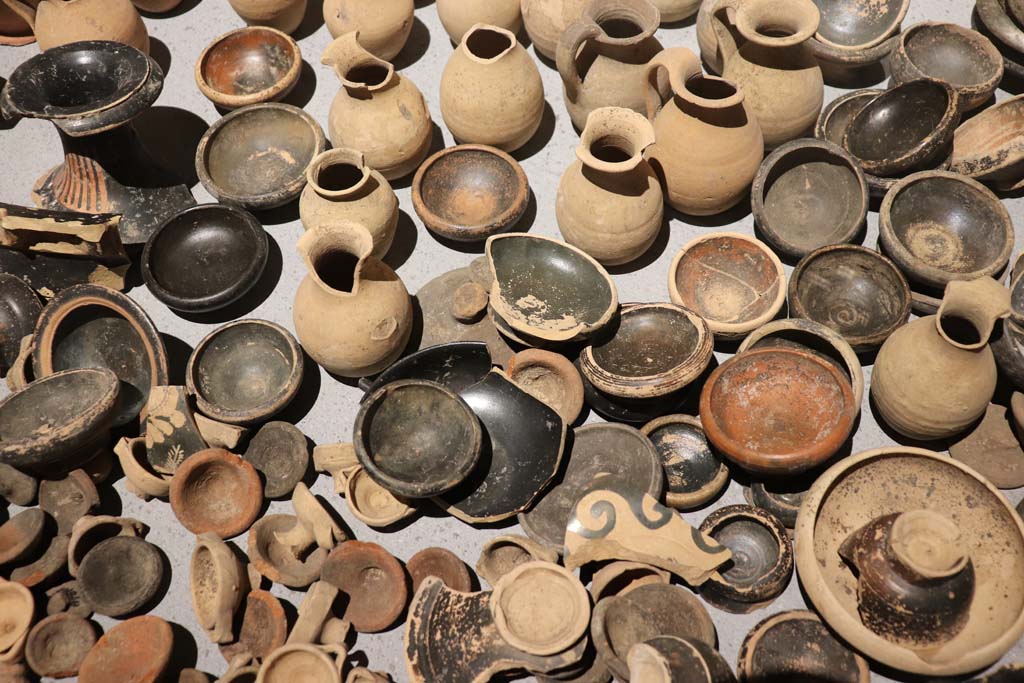 VIII.1.4 Pompeii. February 2021. Santuario extraurbano del Fondo Iozzino. 
Terracotta votive offerings: miniature chalices and small cups, small jugs and statuettes.
Photo courtesy of Fabien Bivre-Perrin (CC BY-NC-SA).
