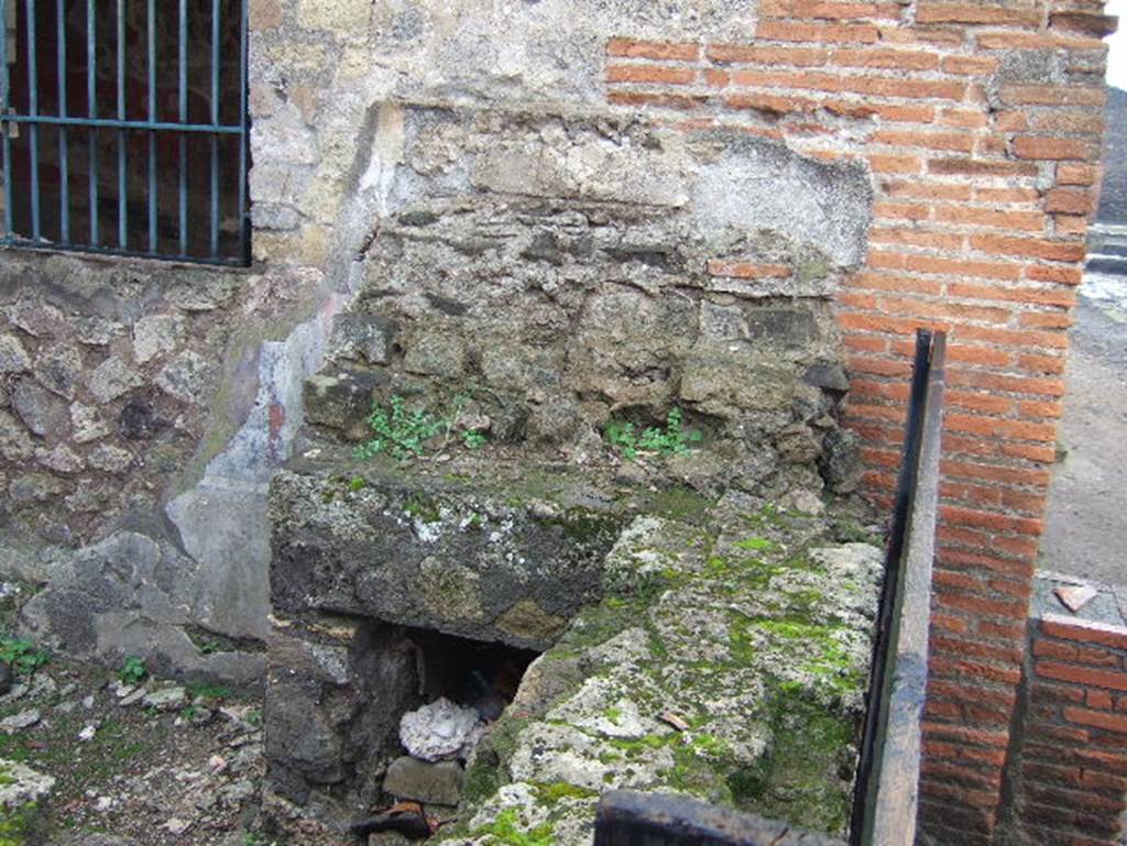 VIII.2.24 Pompeii. December 2005. Looking west to remains of small display shelves on top of bar counter.