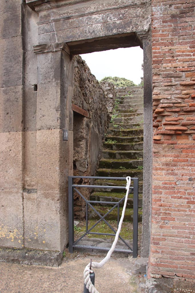 VIII.3.10 Pompeii. May 2024. 
Steps to upper floor, and doorway in east wall into VIII.3.11. Photo courtesy of Klaus Heese.
