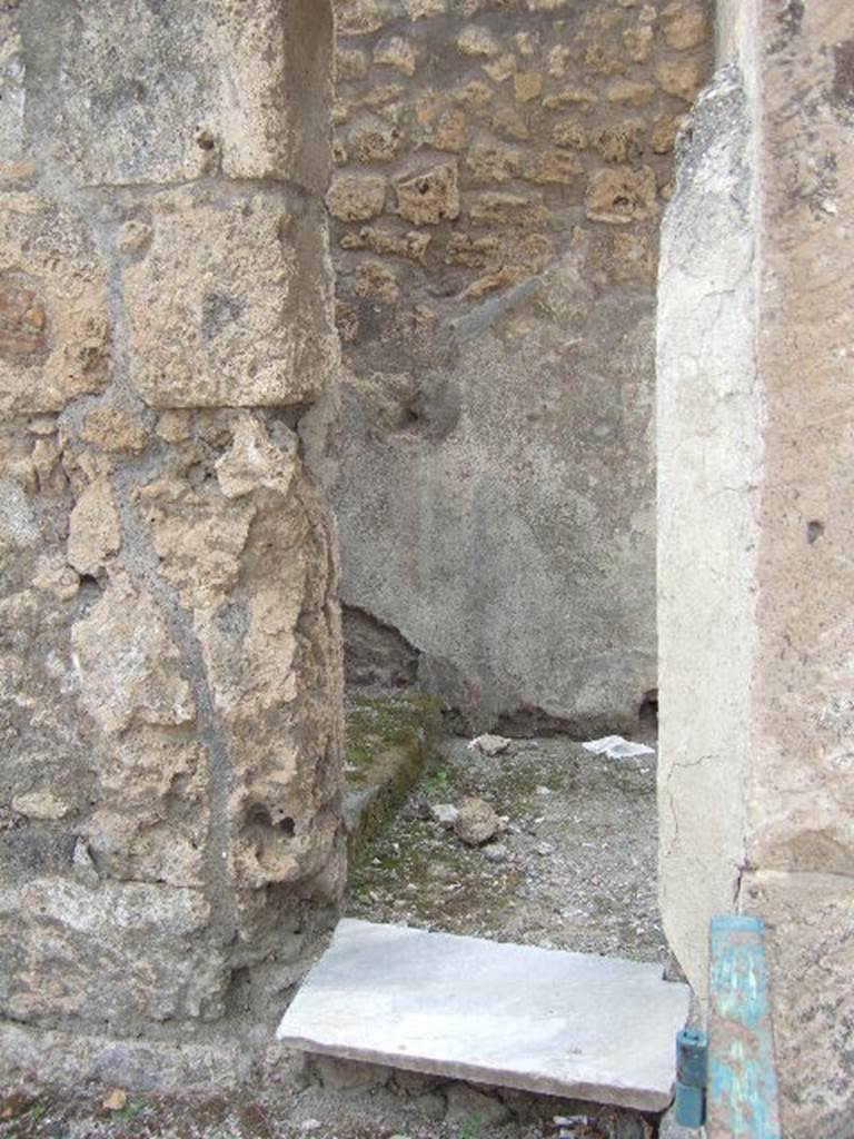 VIII.3.11 Pompeii. May 2006. Doorway in west wall, leading to steps to upper floor at VIII.3.10.