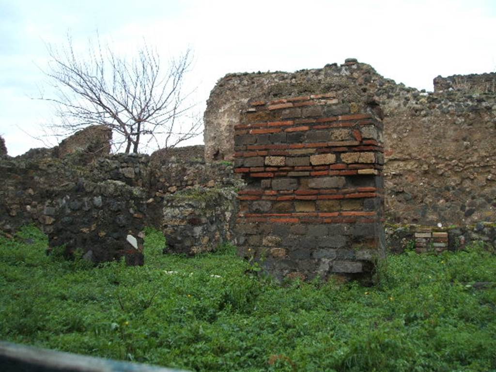 VIII.3.15 Pompeii. December 2004. Looking towards north-west, from entrance doorway. 
The pilaster on the left would have divided rooms 3 from 2, and the pilaster on the right would have divided rooms 2 from 1.
In the doorway between is the white threshold leading to the south portico.


