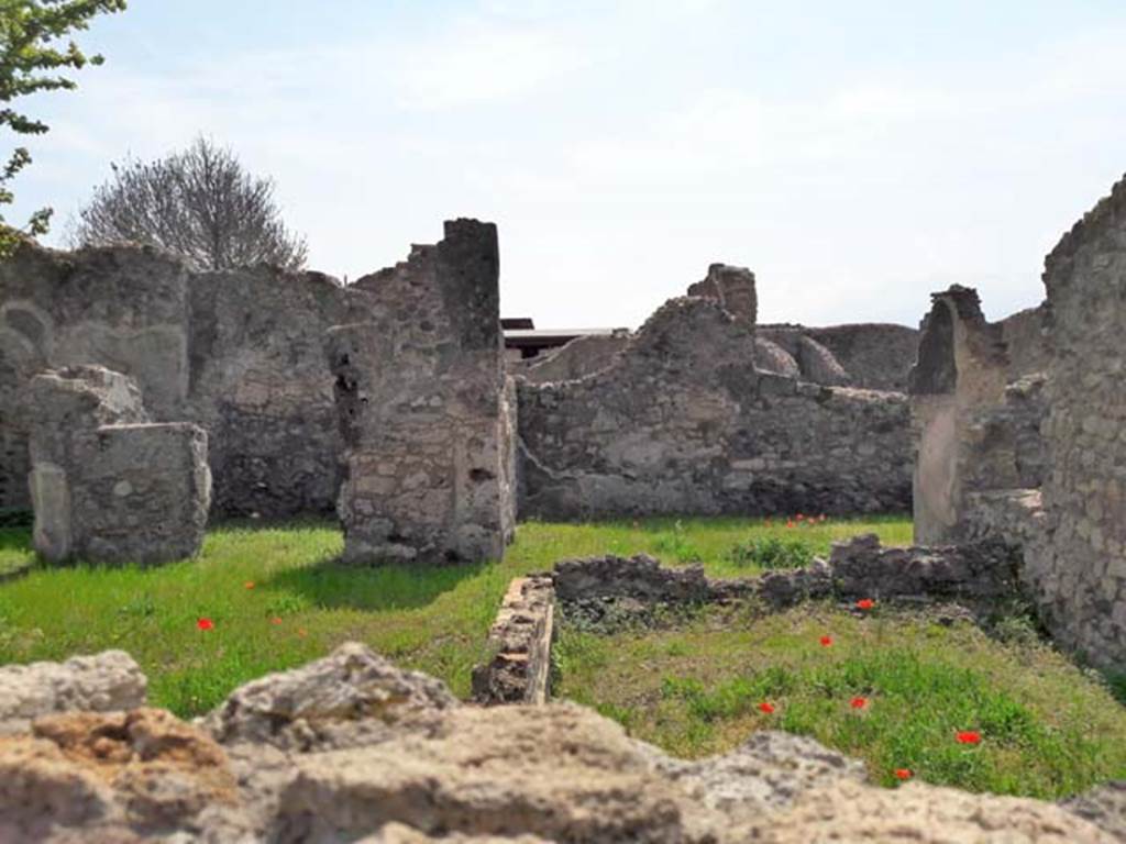 VIII.3.21 Pompeii. April 2017. Looking south across garden area (8), front right, with room 3 rear left.
Room 2 at the end of the entrance corridor is rear right in the photo. 
Photo taken over wall from VIII.3.24.
Photo courtesy of Dr Paul J. Turner.

