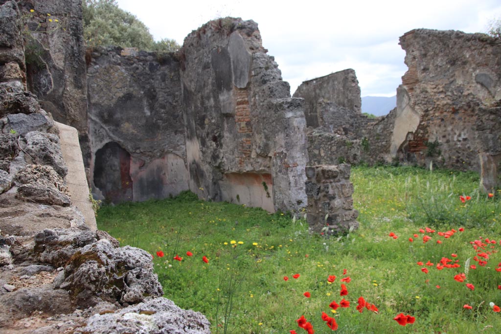 VIII.3.21 Pompeii. May 2024. 
Looking south-east over wall in VIII.3.24 towards triclinium (6), on left, and room (4), on right. Photo courtesy of Klaus Heese.

