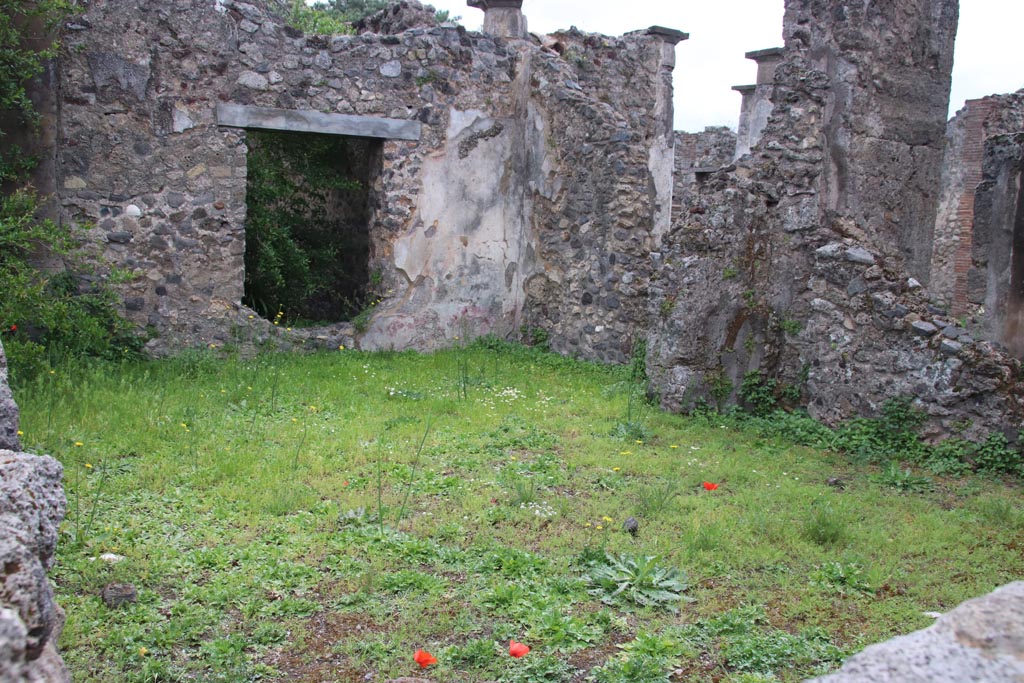 VIII.3.28 Pompeii. May 2024. 
Looking south-east across the site of the rear room towards the portico of VIII.3.27, on right. Photo courtesy of Klaus Heese.  
