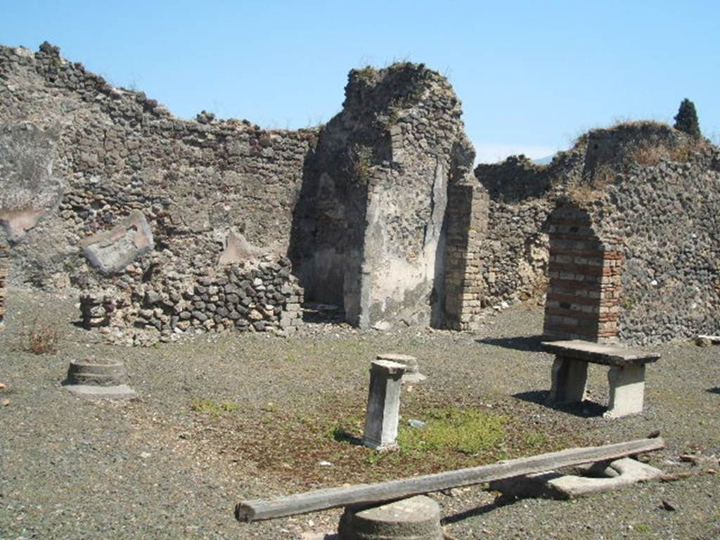 VIII.4.9 from VIII.4.8 Pompeii. May 2005. Looking across atrium with remains of impluvium.