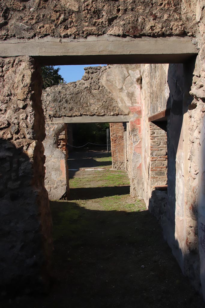 VIII.5.16 Pompeii. October 2022. 
Doorway in west wall of room 7, looking across room 6, into room 5, and onto north portico.
Photo courtesy of Klaus Heese. 
