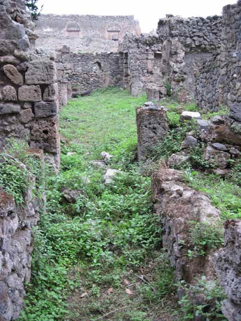 VIII.7.6 Pompeii. September 2010. Corridor of rear room suite, looking north past doorways to rooms 1 (left)  and 2 (right), and along portico.
Photo courtesy of Drew Baker.
