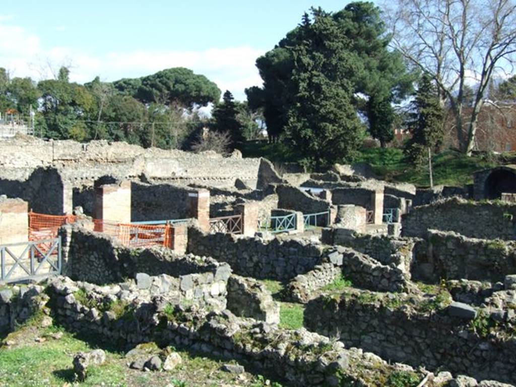 VIII.7.12 Pompeii. March 2009. Looking south-east towards front entrances of VIII.7.13 and 12.  From rear.