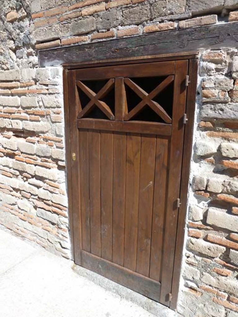 VIII.7.16 Pompeii. September 2015. Doorway to room on the east side, with new door.