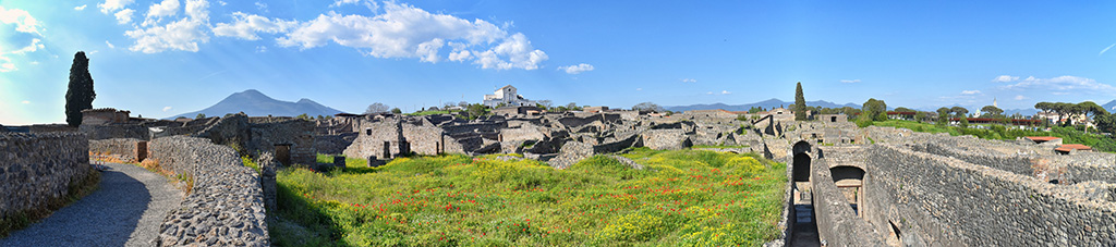VIII.7.21 Pompeii, on left. April 2018. 
Looking north-east from upper level of large theatre towards Vesuvius, across garden of VIII.7.26 and 24 and with the passages to theatres, on the right. Photo courtesy of Ian Lycett-King. Use is subject to Creative Commons Attribution-NonCommercial License v.4 International.


