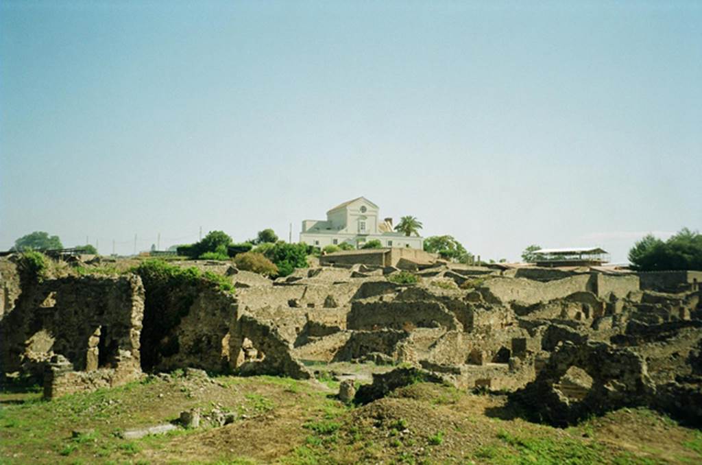 VIII.7.26 Pompeii. July 2010. Looking north-east from Large Theatre, overlooking the large rear garden. Photo courtesy of Rick Bauer. On the north the garden had a columned portico (stumps of columns just visible) that was entered from the atrium, on the left of the photo.