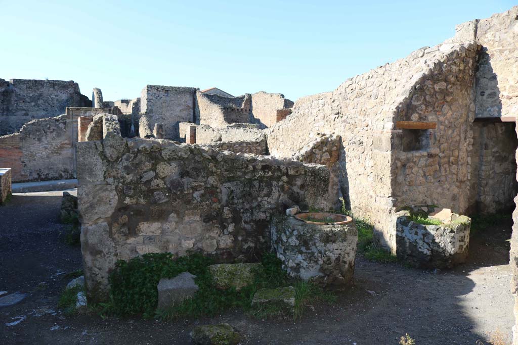 IX.1.3/33 Pompeii. December 2018. Looking west across rear room in bakery, towards two tubs. Photo courtesy of Aude Durand.