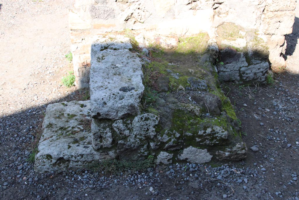 IX.1.3 Pompeii. October 2022. 
Looking north towards lower stone steps of stairs to upper floor, on east side of doorway to cubiculum, on left. Photo courtesy of Klaus Heese

